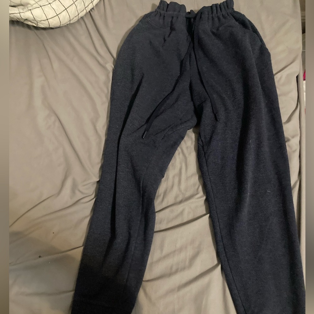 Dark grey with a blue undertone. These are adjustable synched waste sweatpants.